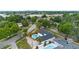 Beautiful aerial view highlighting a home with a backyard pool, lush landscaping and city views at 4804 Oakbrooke Pl, Orlando, FL 32812