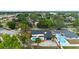 Aerial view of the home with a private pool and lush landscaping in a desirable neighborhood at 4804 Oakbrooke Pl, Orlando, FL 32812