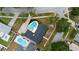 Stunning aerial view of the private backyard oasis and lush landscaping surrounding the home at 4804 Oakbrooke Pl, Orlando, FL 32812