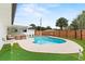 Beautiful backyard featuring a swimming pool, putting green and a privacy fence at 4804 Oakbrooke Pl, Orlando, FL 32812