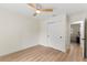 Bright bedroom with a ceiling fan, closet and light wood floors at 4804 Oakbrooke Pl, Orlando, FL 32812