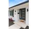 Close up of the front door area with attractive landscaping at 4804 Oakbrooke Pl, Orlando, FL 32812