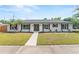 Charming single-story home featuring a well-manicured lawn, clean lines, and modern curb appeal at 4804 Oakbrooke Pl, Orlando, FL 32812