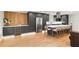 Modern kitchen featuring a large island with seating, stainless appliances, and ample cabinetry at 4804 Oakbrooke Pl, Orlando, FL 32812