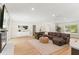 Spacious living room with fireplace, television and large sofa, great for entertaining at 4804 Oakbrooke Pl, Orlando, FL 32812