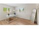 Bright home office with natural light, wood-look flooring and modern decor at 4804 Oakbrooke Pl, Orlando, FL 32812