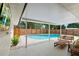 Covered patio with a view of the backyard pool, a great place to entertain at 4804 Oakbrooke Pl, Orlando, FL 32812