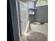 Bright bathroom featuring modern fixtures, tub with tray, and window for natural light at 5005 Mill Stream Rd, Ocoee, FL 34761