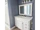 Modern bathroom features a vanity with a white countertop and ample storage at 5005 Mill Stream Rd, Ocoee, FL 34761