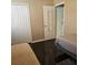Spacious bedroom featuring two twin beds with hardwood floors and natural lighting at 5005 Mill Stream Rd, Ocoee, FL 34761