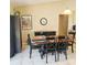 Comfortable dining area with a wooden table, dark chairs, and storage cabinet at 5005 Mill Stream Rd, Ocoee, FL 34761