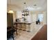 Bright and airy dining area adjacent to the kitchen with a pendant light and decor at 5005 Mill Stream Rd, Ocoee, FL 34761