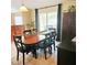 Inviting dining area with dark wooden furniture and a sliding glass door to the backyard at 5005 Mill Stream Rd, Ocoee, FL 34761