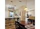 Dining area showcasing a wooden table, chairs, and adjacent kitchen space at 5005 Mill Stream Rd, Ocoee, FL 34761