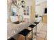 Spacious kitchen island with granite countertops and seating for three at 5005 Mill Stream Rd, Ocoee, FL 34761