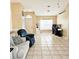 Spacious living room with a large window and tile flooring at 5005 Mill Stream Rd, Ocoee, FL 34761