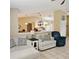 Living room with view to the kitchen, featuring tile floors, neutral walls, and open floor plan at 5005 Mill Stream Rd, Ocoee, FL 34761