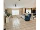 Open concept living room with tile flooring and seamless transition to the kitchen at 5005 Mill Stream Rd, Ocoee, FL 34761