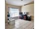 Well lit office space with large window, neutral paint, and light tile flooring at 5005 Mill Stream Rd, Ocoee, FL 34761