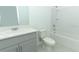 Clean bathroom featuring a modern vanity and a tub with a shower at 5153 Forget Me Not Ave, Lake Hamilton, FL 33851