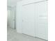 Hallway with carpet, neutral walls, white doors, natural light, and an open feel at 5153 Forget Me Not Ave, Lake Hamilton, FL 33851