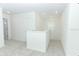 A second floor loft area featuring carpet, neutral walls, natural light, and plenty of space at 5153 Forget Me Not Ave, Lake Hamilton, FL 33851