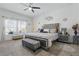 Stylish bedroom with a tufted headboard and plenty of natural light at 588 Hitch Loop, St Cloud, FL 34769