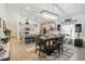 Open concept living space combining dining, kitchen, and entertainment setup at 588 Hitch Loop, St Cloud, FL 34769
