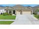 Charming single-Gathering home with well-manicured lawn, a two-car garage, and inviting curb appeal at 588 Hitch Loop, St Cloud, FL 34769