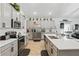 Bright kitchen featuring stainless steel appliances, a large island, and stylish countertops at 588 Hitch Loop, St Cloud, FL 34769
