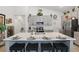 Modern kitchen with a large island, breakfast bar, and stainless steel appliances at 588 Hitch Loop, St Cloud, FL 34769