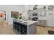 Modern kitchen with a large island, breakfast bar, and stainless steel appliances at 588 Hitch Loop, St Cloud, FL 34769