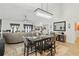 Open-concept living room featuring elegant lighting, dining area, and comfortable seating at 588 Hitch Loop, St Cloud, FL 34769