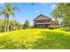 Large, well-maintained yard featuring screened in porch and lush greenery at 6375 Topsy Trl, St Cloud, FL 34771