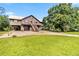 Elevated home boasting covered parking, inviting balconies, and a well-manicured lawn at 6375 Topsy Trl, St Cloud, FL 34771