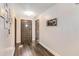 Bright foyer featuring dark wood floors, fresh paint, and decorative trim at 6375 Topsy Trl, St Cloud, FL 34771