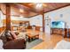 Open-concept living area with kitchen, dining, and living room. Features wood-paneled ceiling at 6375 Topsy Trl, St Cloud, FL 34771