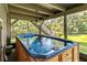 Back porch features a luxurious built-in hot tub at 6375 Topsy Trl, St Cloud, FL 34771