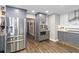 Spacious kitchen boasting stainless steel appliances and sleek grey cabinets at 6375 Topsy Trl, St Cloud, FL 34771
