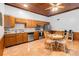 Kitchen dining area features stainless steel appliances, tile floors, and wood cabinets at 6375 Topsy Trl, St Cloud, FL 34771