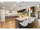 Open-concept kitchen with granite countertops, stainless appliances, and an island with seating at 6375 Topsy Trl, St Cloud, FL 34771