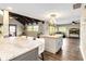 Open floor plan with beamed ceilings, recessed lighting, and eat-in kitchen at 6375 Topsy Trl, St Cloud, FL 34771