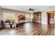 Cozy living room featuring hardwood floors, natural light, and stylish furnishings at 6375 Topsy Trl, St Cloud, FL 34771