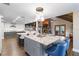 Spacious open floor plan with stone countertops, recessed lights and wine fridge at 6375 Topsy Trl, St Cloud, FL 34771