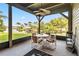 Screened porch with lake view and outdoor seating area at 6375 Topsy Trl, St Cloud, FL 34771