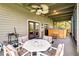Outdoor patio with ceiling fan, furniture, and a built-in hot tub at 6375 Topsy Trl, St Cloud, FL 34771