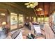 Screened in porch with vaulted ceilings, outdoor furniture, and view into living room at 6375 Topsy Trl, St Cloud, FL 34771