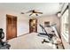 Spacious exercise room with treadmill, rower, and natural light at 6375 Topsy Trl, St Cloud, FL 34771