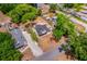 Aerial view highlighting the property's location within a residential area with mature trees and ample green space at 712 Maryland Ave, St Cloud, FL 34769