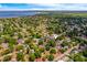 Aerial view of a neighborhood close to a body of water, showcasing the surrounding landscape and community at 712 Maryland Ave, St Cloud, FL 34769